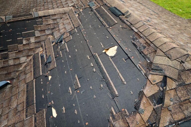 sun damaged asphalt shingles showing curling, cracking, and granule loss before roof repair